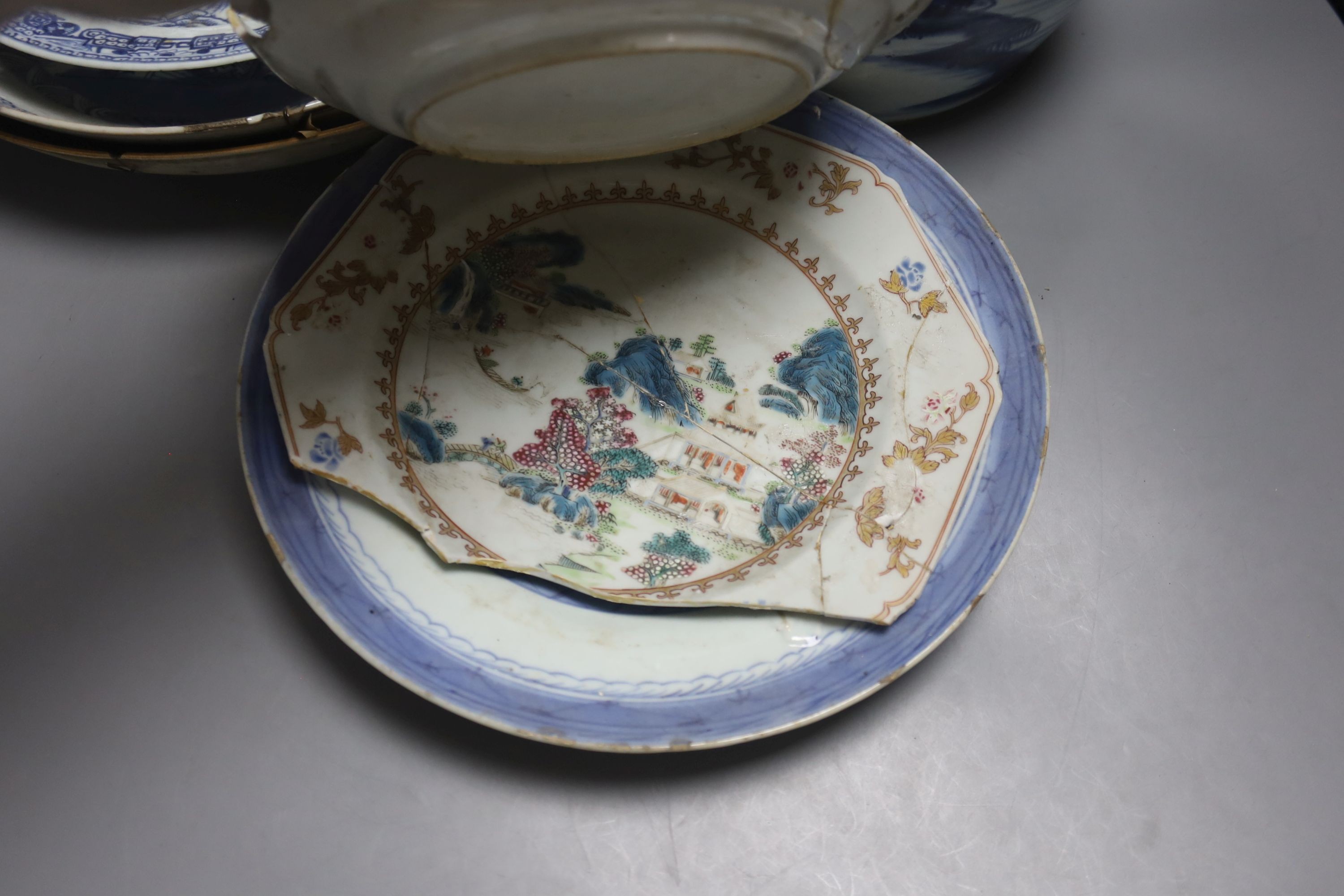 A group of 18th century Chinese export blue and white dishes, plates and a jar, the jar 21.5cm high